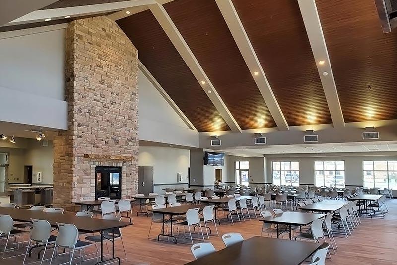 Dining Facility interior with stone fireplace